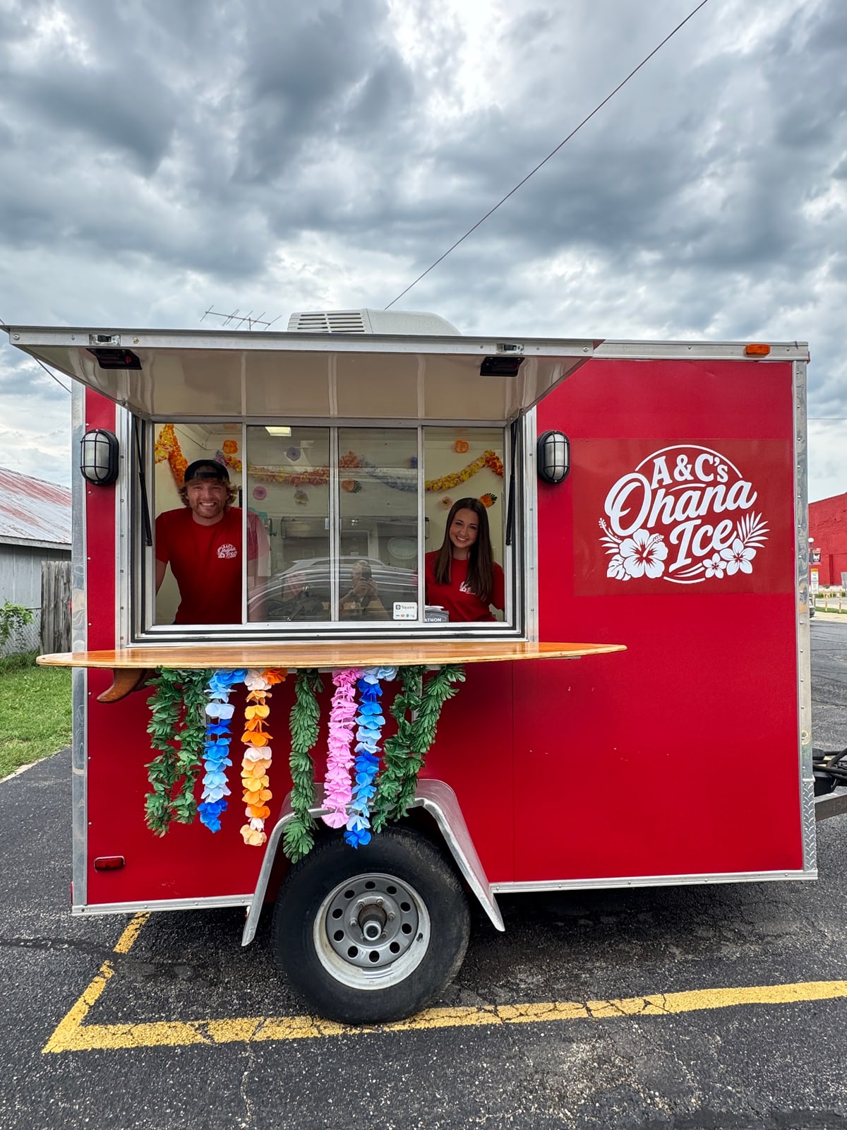 A & C's Ohana Ice red trailer with staff at the serving window